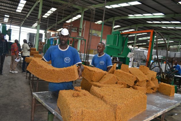 Experts are calling on countries to change their policies to protect locally produced products. For example, Nigeria is an exporter of rubber but imports tyres; Ghana exports cocoa, but Switzerland is known for chocolate. Here a worker in a factory in Abidjan holds a block of rubber meant for export for processing into finished products abroad.