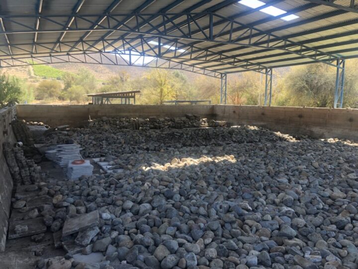 The Huatulame treatment plant in the rural municipality of Monte Patria in northern Chile is being completely repaired with the support of the local municipality. Waterproof plastic sheeting and boulders have been installed, and in the final stage sawdust and earthworms will be incorporated before receiving wastewater from local households for reuse. CREDIT: Orlando Milesi / IPS