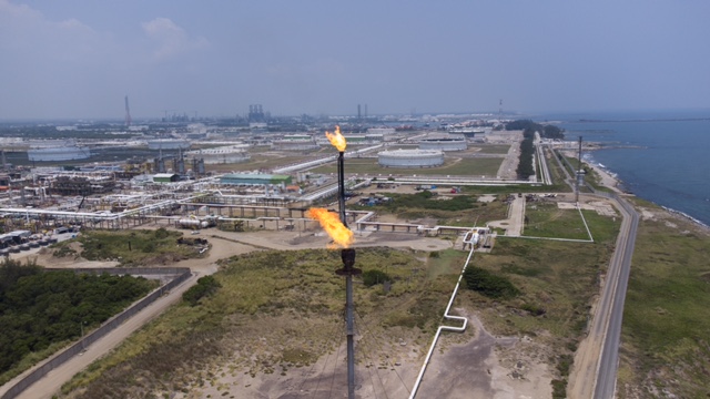 Two flares burn gas in the Nuevo Torno Largo neighborhood, in the municipality of Paraíso, in the vicinity of the Olmeca refinery. The southeastern state of Tabasco, on the coast of the Gulf of Mexico, has suffered the effects of pollution generated by oil production for more than 50 years through spills, contaminating gases, and water, air and soil pollution. CREDIT: Erik Contreras-Gerardo Morales / IPS