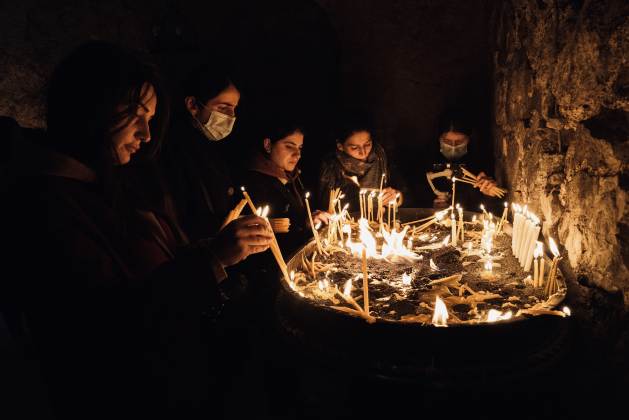 A group of women pray in the Dadivank monastery during the 2020 war. The enormous Armenian archaeological heritage is among the victims of the war between Armenians and Azerbaijanis. Credit: Karlos Zurutuza/IPS - On September 19, the sound of bombs reminded the world of a long-forgotten conflict. In the Caucasus, the Azerbaijan’s army was launching a massive attack against a small enclave, Nagorno-Karabakh