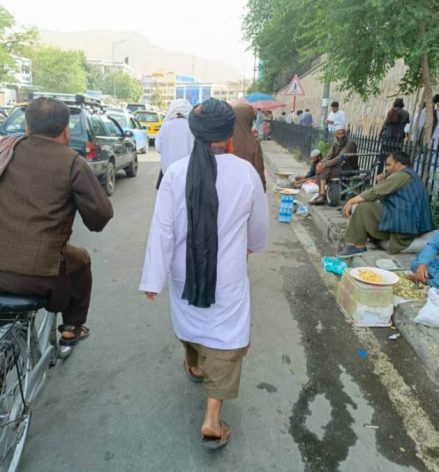 The man dressed in white represents the Ministry for Propagation of Virtue and Prevention of Vice. His presence causes fear on the emptying streets of Kabul. Credit: Learning Together