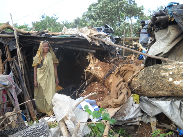 Cyclone Phailin in 2013 wrought maximum damage and loss of life as rural settlements had only mud-walled, thatched-roofed homes. A woman stands desolately, having lost her home and belongings to the storm in Bhubaneswar. Credit: Manipadma Jena/IPS