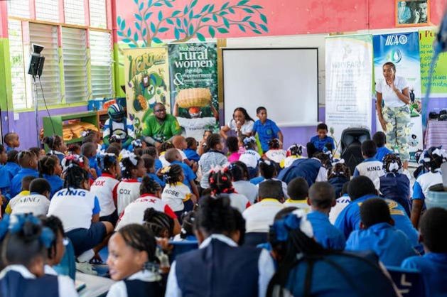 Keithlin Caroo speaks to young Saint Lucian on International Rural Women’s Day. Education is an important part of advocacy on behalf of women and girls. Credit: Alison Kentish/IPS