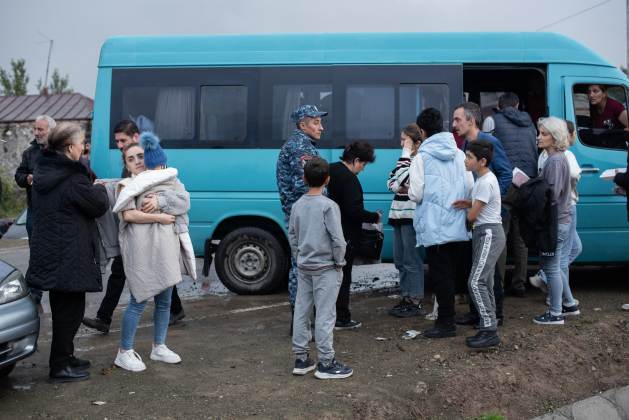 Refugees in Kornidzor, the first town on the Armenian side of the border, on September 25.  Many arrived empty-handed after fleeing on foot through the forest and under bombardment.  Credit: Gaiane Yenokian/IPS
