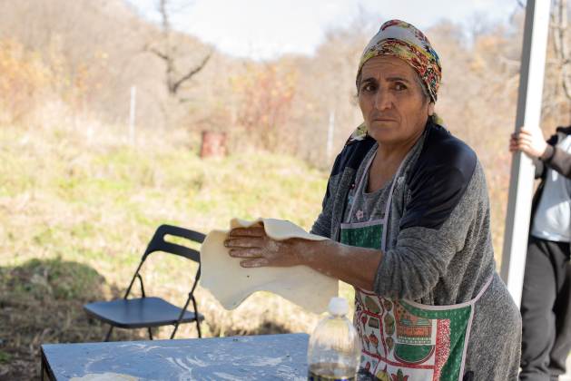 Romela Avanesyan prepares a traditional Nagorno-Karabakh dish.  As winter approaches, these displaced people are dependent on both the government and international aid.  Credit: Gaiane Yenokian/IPS