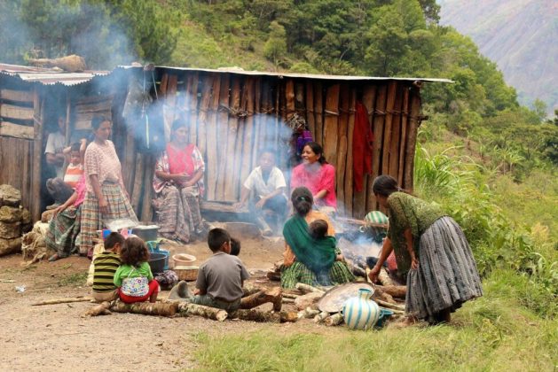 A family from the Q'eqchi Mayan indigenous people of Guatemala gathers to share a meal cooked with firewood. Life in many rural areas of Latin America continues to be marked by scarce resources and inequality, in comparison with urban areas. CREDIT: IDB