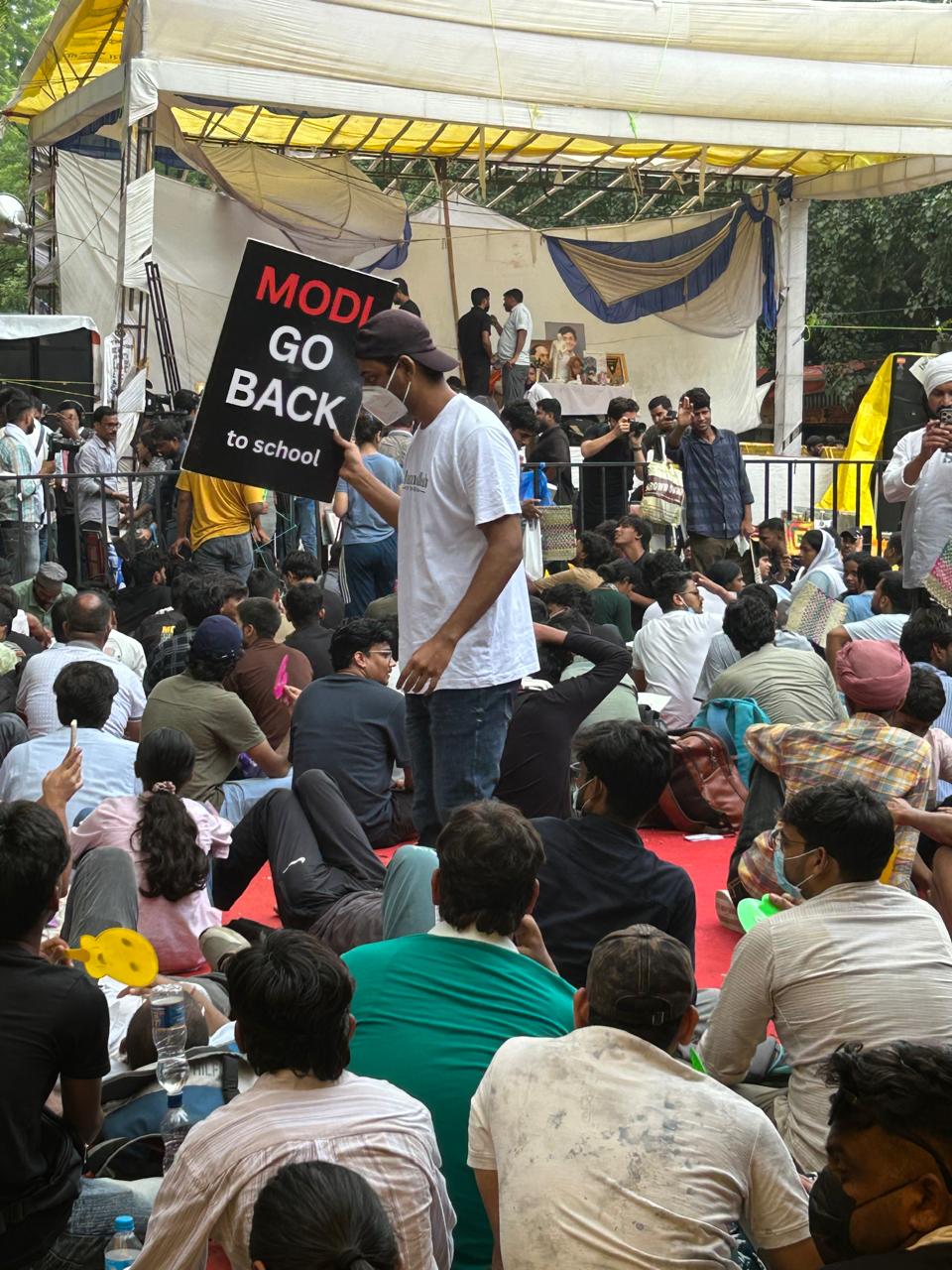 Protesters gather at the main stage at Jantar Mantar, where peaceful demonstrations and slogans continued throughout the sit-in. The stage later became the focal point of the movement as education reformer Sonam Wangchuk began his indefinite hunger strike. Aishwarya Bajpai/IPS